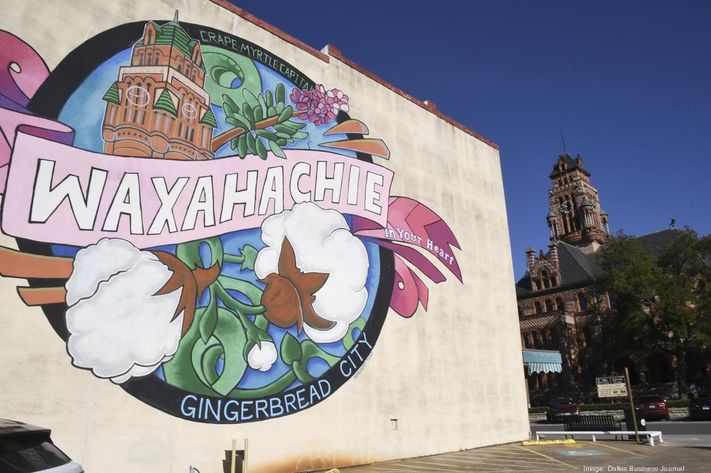 Picture of downtown Waxahachie TX, the "Crape Myrtle Capital" and "Gingerbread City". The picture has a mural in downtown with the famous courthouse in the background.